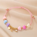Macro detail of adjustable beaded bracelet with heart charms and C letter on silk - Letter C