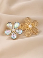 Close-up of golden hair clip with iridescent rhinestones and pearls on champagne silk - Double Flower Style