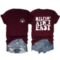 Detail of burgundy T-shirt with white skull hand print and MILFIN slogan on cotton fabric - Burgundy