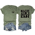 Detail of MILFIN' AIN'T EASY skull print on a heather green T-shirt and denim shorts - Olive Green