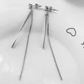 Elegant silver tassel earrings with geometric metal bar and fine chain on ceramic tray - Default