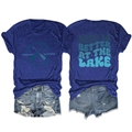 Detail view showing 'Life is Better at the Lake' print and vintage denim shorts - Vintage Blue