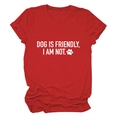 Close-up of 'DOG IS FRIENDLY' white text print on red cotton crew neck T-shirt - Red (White Font)