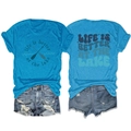 Detail showing knit texture and life is better at the lake print on a blue t-shirt - Lake Blue