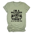 Close-up of humorous multitasker slogan print on sage green cotton t-shirt fabric - Olive Green (Black Font)