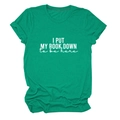 Close-up of emerald green cotton T-shirt featuring white I Put My Book Down printed slogan - S / Dark Green (White Font)