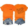 Detail view of orange cotton t-shirt with She Overcame Everything print and heart logo - Orange (Black Print)