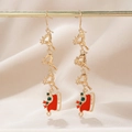 Detail of gold reindeer earrings with red sled charms and festive gemstone accents - Gold Reindeer Red Sleigh Style (5)