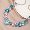 Macro shot of luxury square emerald cut crystals and blue rhinestones on gold necklace - Blue (NQ140)