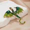 Vintage gouden draak broche met groene emaille vleugels en fonkelende strass - Olijfgroen
