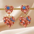 Macro shot of double heart gold drop earrings with multi-color zircon crystal stones - Double Heart Splicing Style (EQ142) / Gold/Pink/Blue
