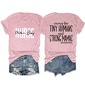 Detailed view of pink nurse t-shirt with Caring for Tiny Humans slogan on the back - S / Pink