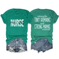 Detail of Caring for Tiny Humans print on a green nurse t-shirt with denim shorts - S / Dark Green
