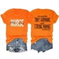 Flat lay of nurse slogan orange t-shirt and ripped denim shorts showing both sides - S / Orange