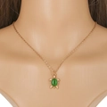 Detailed close-up of golden sea turtle necklace with a green cat-eye stone pendant - Gold Sea Turtle Green Cat Eye Stone Style (NQ107)