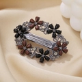 Vintage oval floral spring hair clip with rhinestones on golden silk background - Coffee