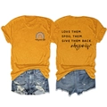 Detail of soft mustard yellow T-shirt showing double-sided rainbow and slogan prints - S / Tops / Mustard Yellow (Black Print)