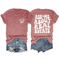 Flat lay of gray real estate t-shirt with back print and distressed denim shorts - Rose Gold (White Graphic)