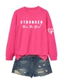 Detail of pink long sleeve sweatshirt with STRONGER lettering and ripped denim shorts - Rose Red
