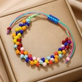 Detail of colorful handmade beaded bracelet on gold satin with adjustable blue string - Colorful Glass Beads