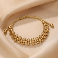 Detail of adjustable double-row gold beaded bracelet on champagne satin background - Gold Smooth CCB Beads