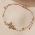 Detailed macro view of woven bracelet featuring an EKG heartbeat charm with crystals - EKG (Heartbeat Pulse Line)