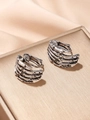 Dettaglio macro di orecchini vintage a forma di mano scheletro in argento antico - Argento Antico (Paio)