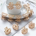 Set of 12 elegant mini golden metal hair claw clips in various shapes for women and girls - Gold