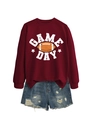 Flat lay of maroon Game Day sweatshirt with vintage rugby print and denim shorts - Wine Red (White Print)