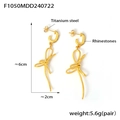 Macro detail of titanium steel bow earrings with rhinestones and 18K gold plating - Gold Bow Tassel (F1050)