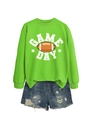 Detail view of Game Day text and football print on neon green sweatshirt with denim shorts - Neon Green (White Graphic)