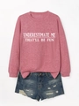 Detail of pink long sleeve sweatshirt with white slogan and distressed denim shorts - Rose Gold (White Print)