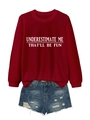 Close-up of burgundy long sleeve sweatshirt with white slogan print and denim shorts - Burgundy