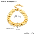 Dettaglio del bracciale in acciaio al titanio placcato oro 18k con maglie geometriche - Bracciale Oro (TXE060)