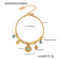 Golden titanium steel snake chain bracelet featuring turquoise charms and sunburst disc - Gold Bracelet