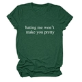 Detail of dark green cotton T-shirt featuring white 'hating me won't make you pretty' print - Vintage Green (White Font)