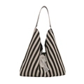 Zebra stripe tote bag with white lace bow decoration and minimalist triangle silhouette - Black