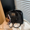 Retro black canvas tote bag with plush bear charm and leather handles in soft window light - With Pendant / Black