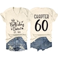 Flat lay of cream V-neck T-shirt with Birthday Queen EST. 1965 and Chapter 60 back print - S / Sand