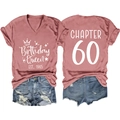 Flat lay of V-neck T-shirt and denim shorts with Chapter 60 Birthday Queen print - Rose Gold (White Font)