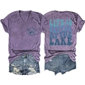 Detail of purple V-neck T-shirt with lake graphic and ripped denim shorts set - Purple