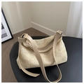 Detail of adjustable khaki leather strap and woven texture on a beige tote bag - Khaki