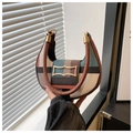 Detail of multi-color geometric pattern crescent bag with golden buckle and leather handle - Green