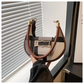 Detail of checkered crescent saddle bag with brown leather trim and golden hardware - Black