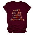 Flat lay of maroon crewneck t-shirt with sorry i'm late i didn't want to stop reading print - Burgundy