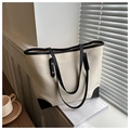 Détail d'un sac cabas beige minimaliste avec poignées noires et rivets dorés élégants - Blanc Sans Pendentif