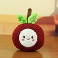 Close-up of cute fruit plush keychain with textured red fabric and green leaf detail - Lychee Shape / Dark Red