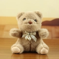 Brown plush teddy bear keychain with beige satin bow and pearl charm details - Brown