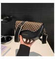 Detail of saddle bag featuring retro floral print flap and stylish wide fabric strap - Clover Black