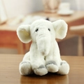 Cute white plush elephant keychain pendant with soft fur and grey paws on wood - Off White